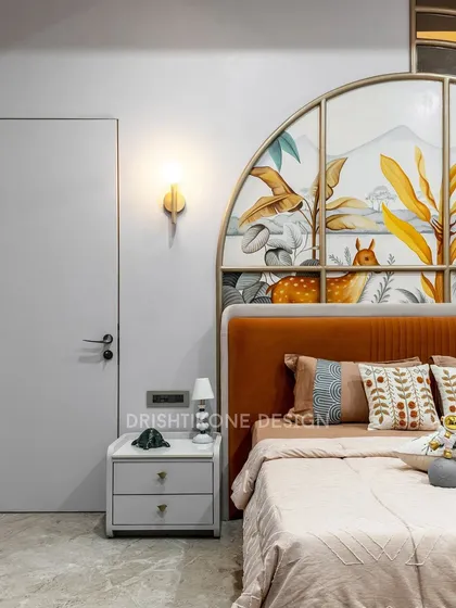 Designing for kids is all about sparking imagination. This room features a beautiful, hand-painted nature mural within a custom arched headboard, creating a whimsical and serene space for a child to dream and grow.