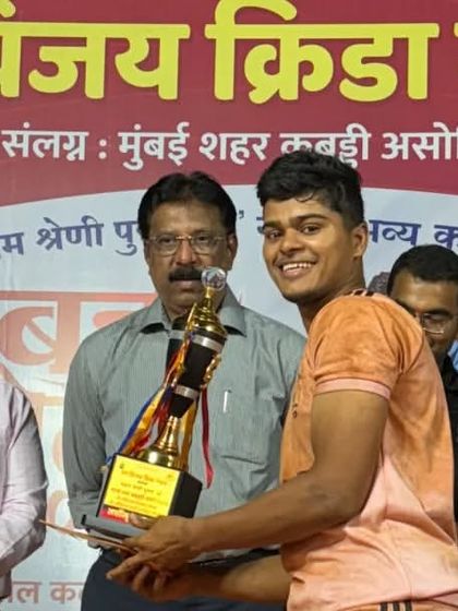 Our player Rahate receiving the 'Best Catcher of the Tournament' award.
