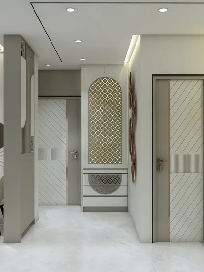 A hallway designed with custom doors and a unique console table featuring a jali pattern. Every detail is considered to ensure a cohesive and elegant flow throughout the home.