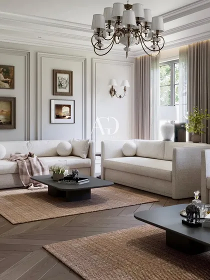 This view demonstrates the full, expansive layout of the living room. The use of multiple area rugs helps to define the different seating zones while maintaining an open, flowing feel.