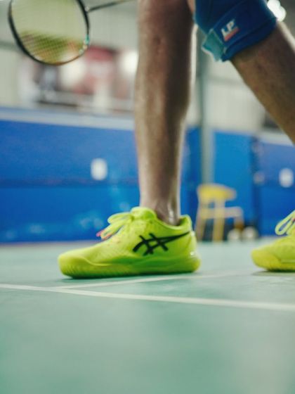 A close-up on the footwork. Badminton is a game of agility and speed. Our events encourage a full-body workout that is so engaging, you forget you are even exercising.
