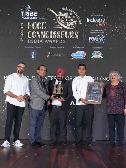 Our chef on stage, receiving the award for 'Best Luxury Caterer of the Year (North)'. A proud moment for the entire CAARA family.