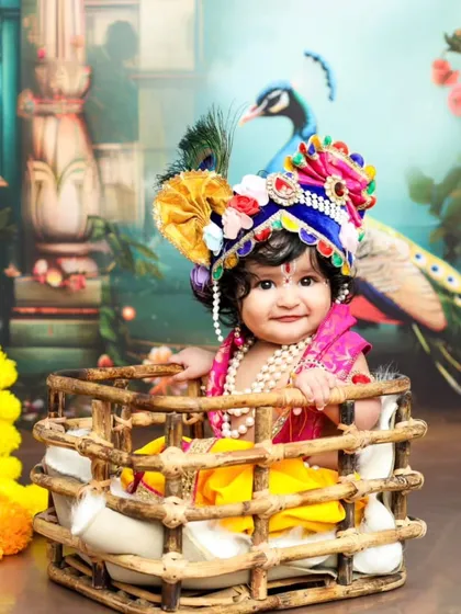 Celebrating culture and tradition is so special. This Janmashtami photoshoot transforms your baby into a divine little Krishna, complete with a peacock feather crown and a beautiful, ornate backdrop.