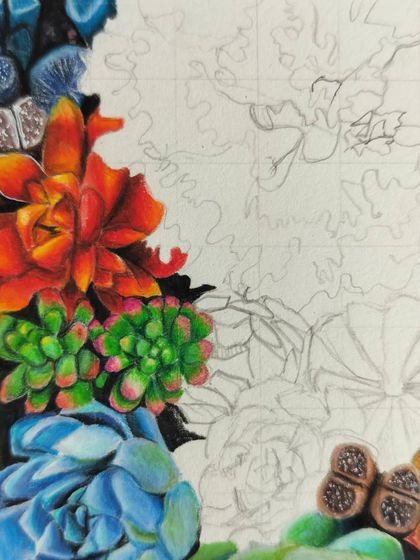 A detail shot of the other side of the succulent piece, showing the bright orange and blue plants.