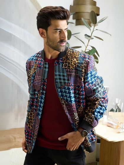 A different angle of the multi-patterned jacket, showing how the various prints and colors come together to create a harmonious and stylish whole.