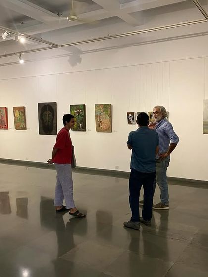 Visitors interacting with the artist during the last days of the 'ME, AMMA, WE' exhibition.