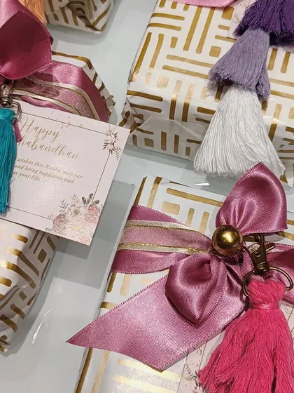Here are more examples of my tassel-adorned gifts. The combination of patterned paper, satin ribbons, and colorful tassels makes each gift box look unique and festive.