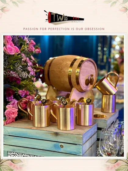 A rustic-chic bar setup with a wooden barrel dispenser for aged cocktails or punches.