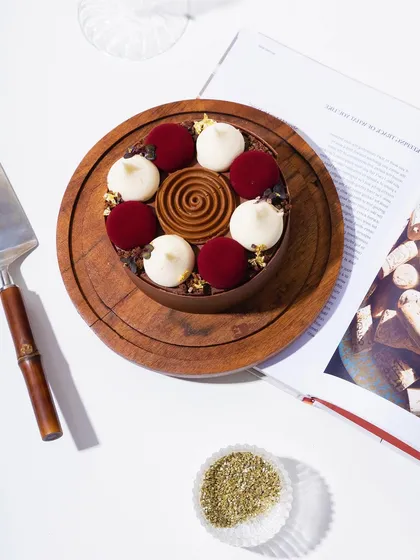 An overhead view of our modern Black Forest cake, showcasing the intricate design of the toppings.