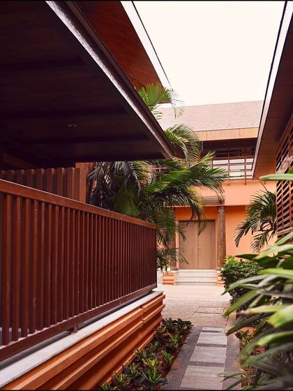 A quiet walkway between our villas, showcasing the clean lines of the architecture and the careful integration of nature into every aspect of the resort's design.