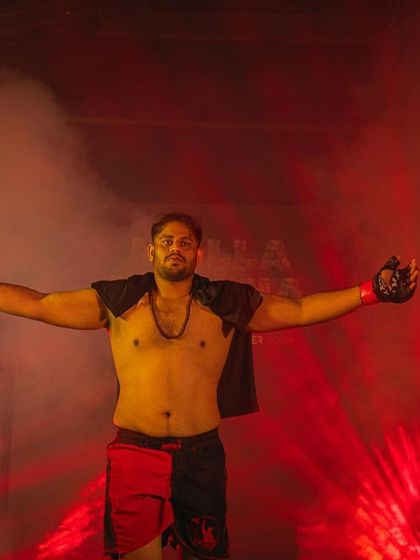 Another angle of the warrior's walkout. The red lights and smoke create an intimidating atmosphere, setting the stage for the battle to come.