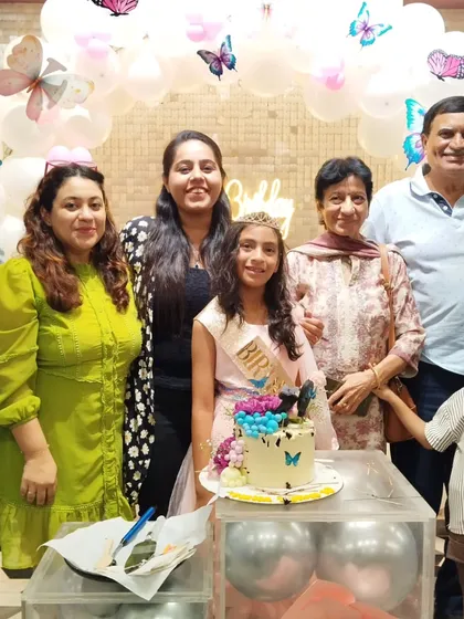 A large family photo capturing the joy of the celebration.