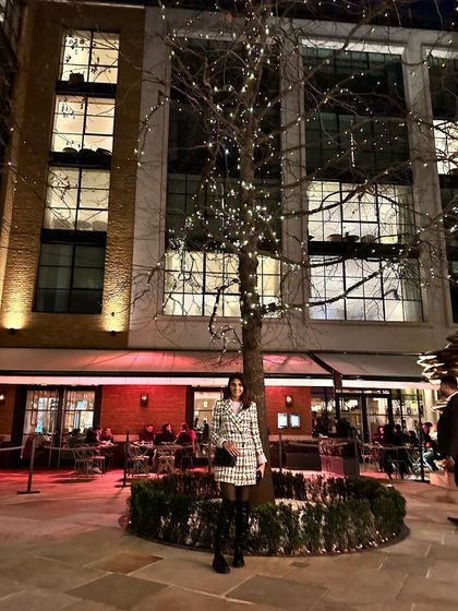 An evening in London's Covent Garden. The tweed coat dress transitions perfectly from day to night, looking just as chic under the festive evening lights.