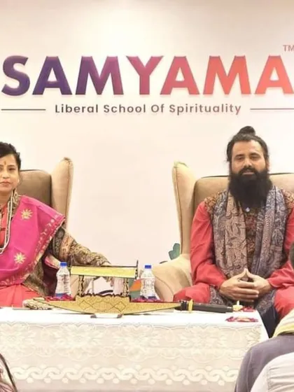 We are seated before an audience during a spiritual retreat in Kashmir. This image captures the intimate setting of our retreats, where participants can engage in deep spiritual learning and meditation in a serene environment.