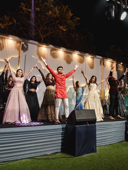 Proof that dancing at your sangeet will leave you with the best memories. This final pose captures the joy of a successful family performance.