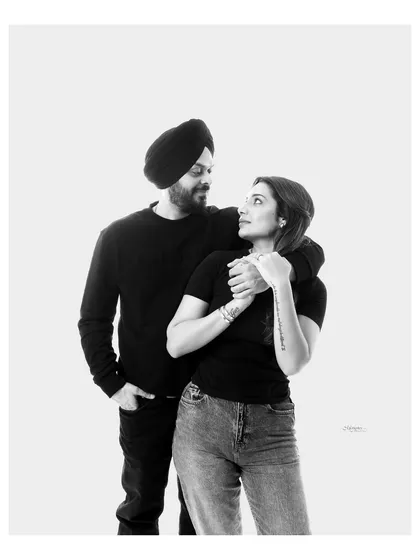 Love in its most honest form. This black and white portrait focuses on the quiet, candid connection between two people, creating a memory that feels as real as the moment itself.