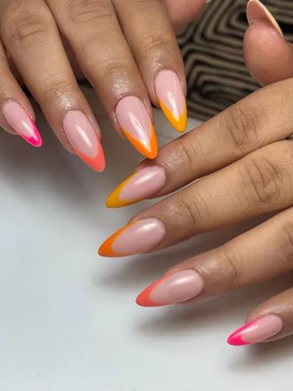 Let's play with color. These sunkissed tropical French tips on long almond extensions are perfect for a vacation or just to brighten your day. This is a modern, vibrant take on a classic style.