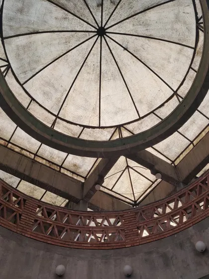 The domed ceiling of the India Habitat Centre, designed by architect Joseph Allen Stein. Completed in 1993, this building was conceived as an integrated urban space combining offices with public activities, representing a post-liberalization approach to architecture and city life.