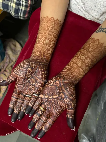 The rich, dark stain on this bridal design is a testament to the quality of natural henna.