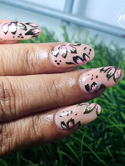 A beautiful floral design with gold foil accents on a nude base. This student work is both elegant and on-trend.