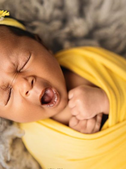 A big yawn from our little sunshine. These candid, unposed moments are just as precious as the sleepy ones and show your baby's budding personality.