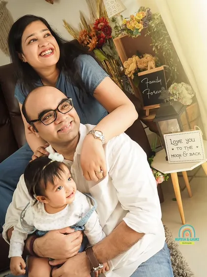 Looking towards a bright future together. This is a lovely, hopeful portrait of a young family enjoying a moment in our sunlit studio.