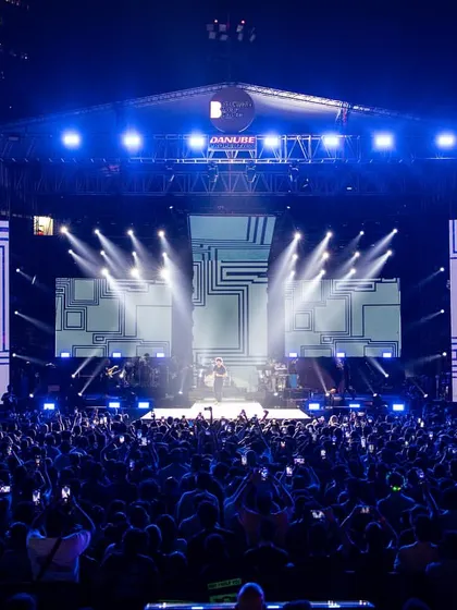 There's no feeling like performing for a massive crowd. Here I am on stage with Farhan Live, sharing the energy with thousands of music lovers at a packed outdoor festival.