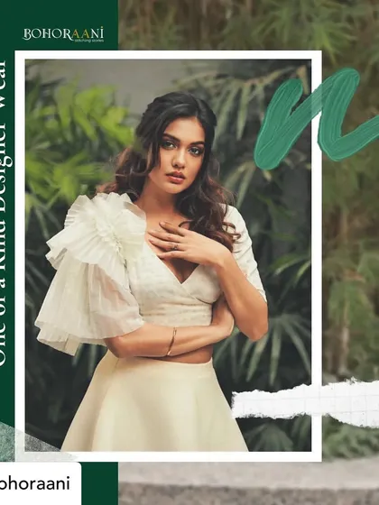 A graphic showcasing the one-of-a-kind designer wear we create. It features Divya Agarwal in our signature ruffled blouse, emphasizing our custom styling services.