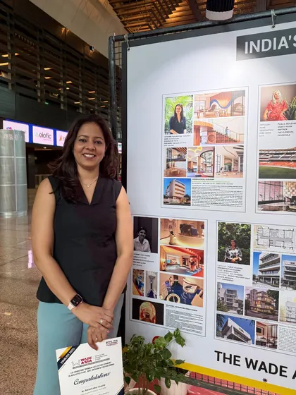 Partner Akanksha Gupta stands with our firm's presentation board after being recognized as a finalist. This acknowledgment for our work in public building design is a testament to our team's dedication to creating meaningful and impactful community spaces.