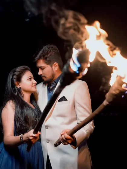 For something truly unique and dramatic, we can do a late-night shoot with fire. The flickering flames create a powerful and unforgettable atmosphere for your couple portraits.