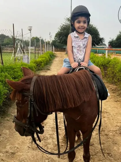 Another happy rider on her first equestrian adventure. We ensure every child's experience is positive and memorable.