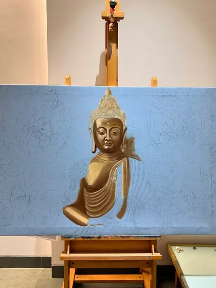 The beginning stages of a Buddha painting. I start with a toned canvas and an underpainting to map out the composition and create a foundation of light and shadow.