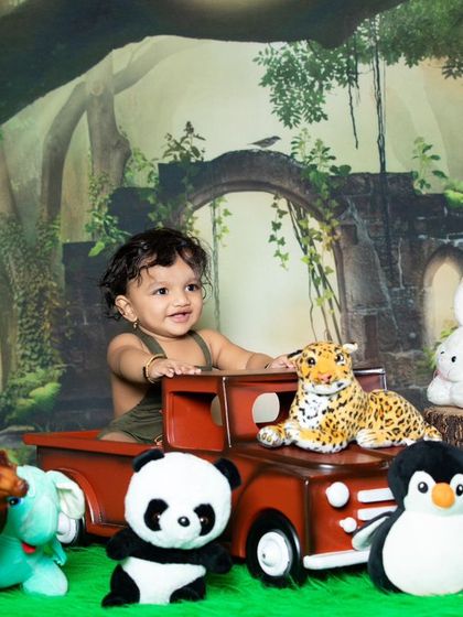 A happy safari driver with his team of plush animals, ready to explore the wild.