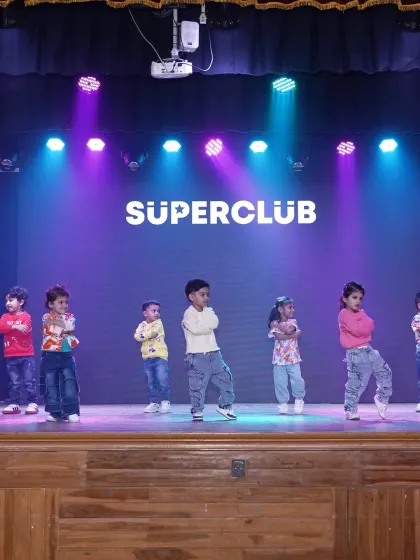 A group of our youngest dancers performing at the 'Superclub' showcase. Even at this age, they learn to hold their positions and perform with confidence for an audience.