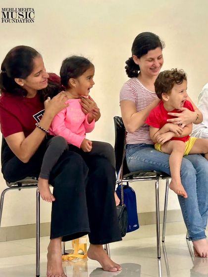 The smiles on the faces of these parents and toddlers say it all. Our classes are a happy, supportive space for families to connect through music.
