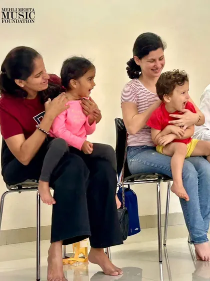 The smiles on the faces of these parents and toddlers say it all. Our classes are a happy, supportive space for families to connect through music.