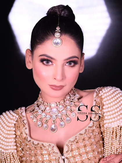 This is the kind of flawless, high-definition bridal makeup I teach in my professional courses. Notice the clean, sharp eye makeup, the perfectly blended skin, and the elegant updo that completes the look.