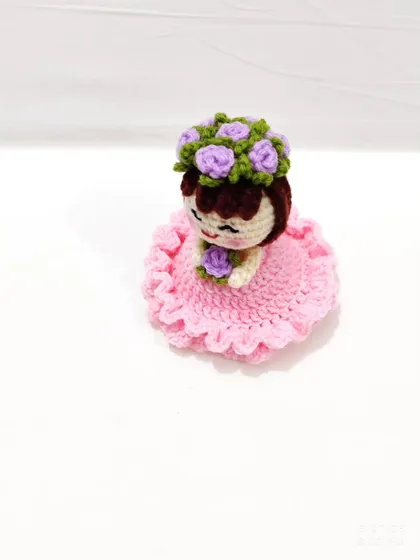 This reversible bouquet doll is two gifts in one. It starts as a beautiful floral bouquet and flips inside out to reveal an adorable doll in a pink frilly dress with a flower crown.