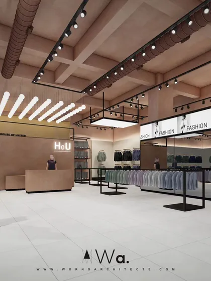 This is a look into an apparel store we designed in Noida, focusing on a raw, industrial aesthetic softened by earthy terracotta tones. The layout uses open display racks and strategic track lighting to create an inviting and modern retail experience.
