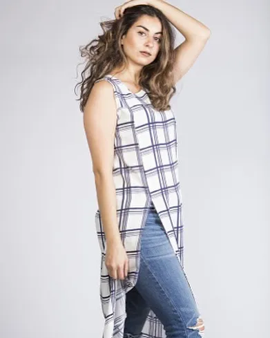 A stylish and casual Indo-western look featuring a long, sleeveless tunic with a high slit, paired with jeans. We can stitch modern kurtis and tops for your daily wear.
