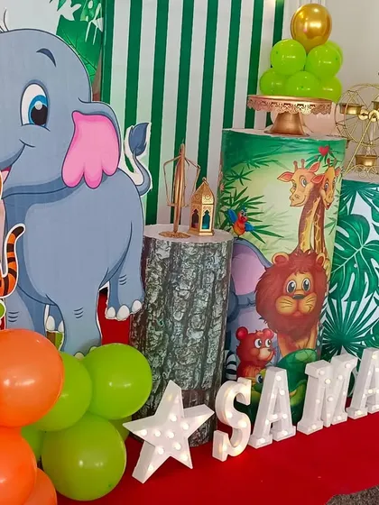 Let's go on an adventure. This jungle-themed birthday party setup is complete with animal cutouts, balloon garlands in earthy tones, and themed props to create a wild and fun celebration for the little explorer in your life.