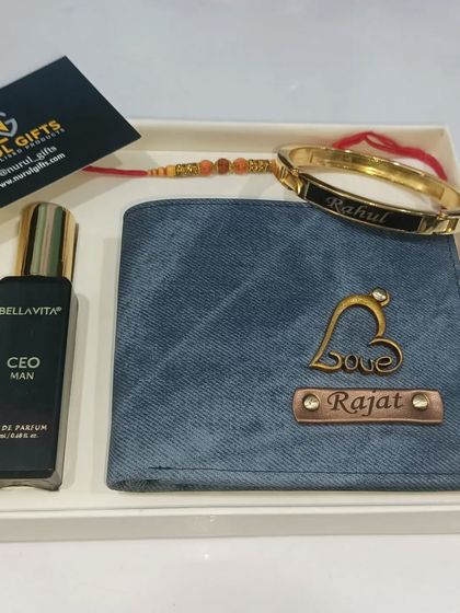 This Rakhi combo includes a personalized denim wallet, a name-engraved kara (bracelet), a Rakhi, and a Bella Vita perfume.
