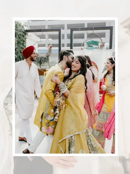 It's the unscripted moments that often tell the best stories. A playful kiss from the groom during the Haldi ceremony, surrounded by the smiles of loved ones, showcases the candid, documentary style I use to capture real emotions.