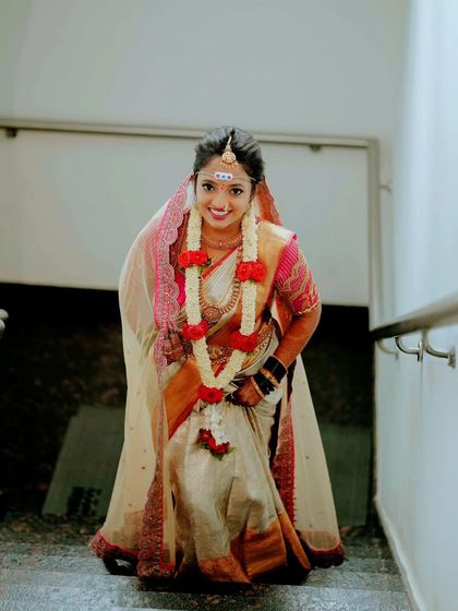 A lovely shot of the bride looking up as she walks up the stairs, capturing a moment of anticipation and her beautiful smile.