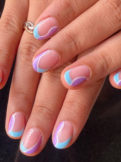 A dreamy pastel swirl design using shades of lavender and baby blue with a fine white line to define the shapes.