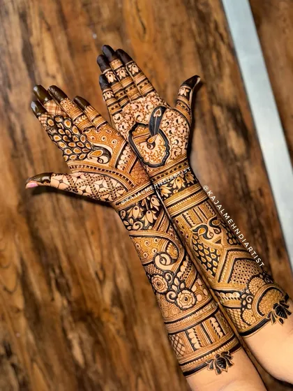A special bridal design where two peacocks come together to form a heart shape when the hands are joined.