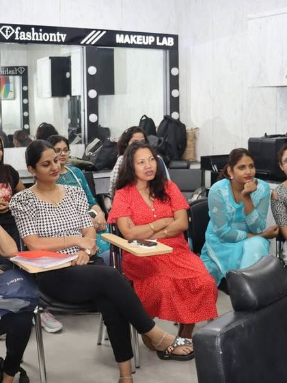 A live demonstration during a makeup class. Our instructors provide step-by-step guidance, and students get to observe techniques up close before practicing themselves.