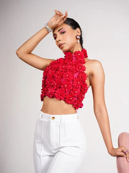 A bold, high-impact studio shot that showcases my ability to style with vibrant colors and intricate details. This look focuses on the handcrafted floral texture of the top, paired with clean white trousers for a balanced, modern aesthetic.