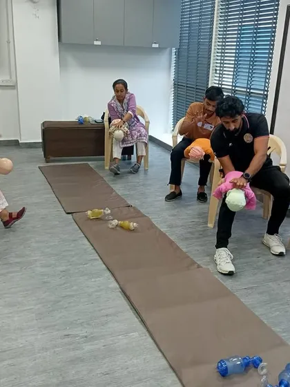 Our CPR training also covered techniques for infants. This image shows us practicing the correct procedure for infant rescue, an essential skill for any first responder.