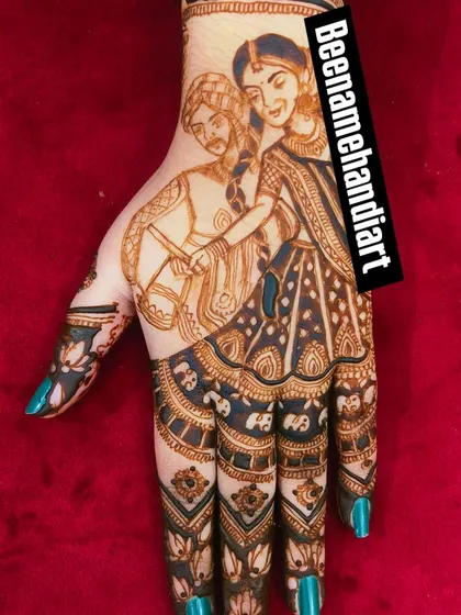 A dandiya-themed portrait of a couple dancing. The fingers are decorated with elephant motifs.